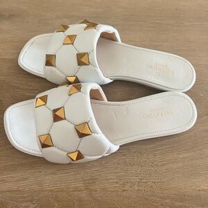 White with gold studs valentino sandals. Size 40 european women’s, lightly used.